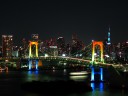 Rainbow_colored_Rainbow_Bridge_at_night